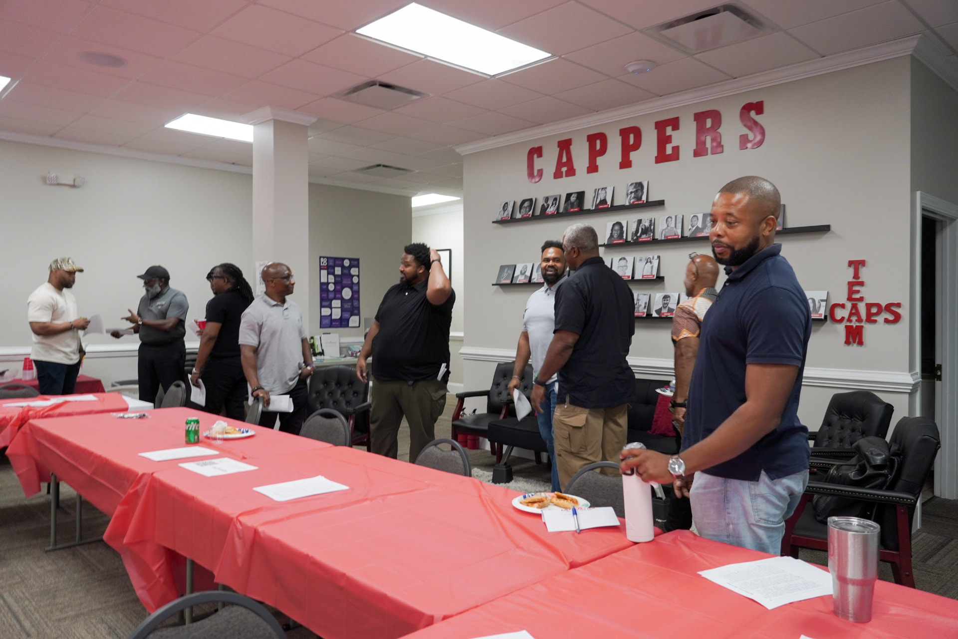 Men Matter brothers gathered around tables at a brotherhood group meeting