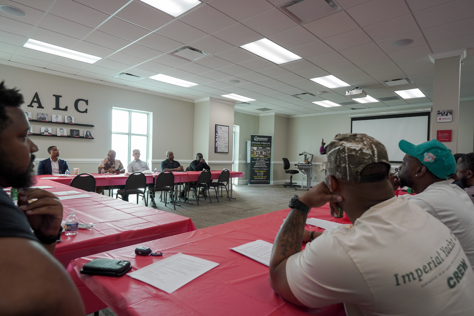 Men Matter members seated and facing the front during a facilitated meeting